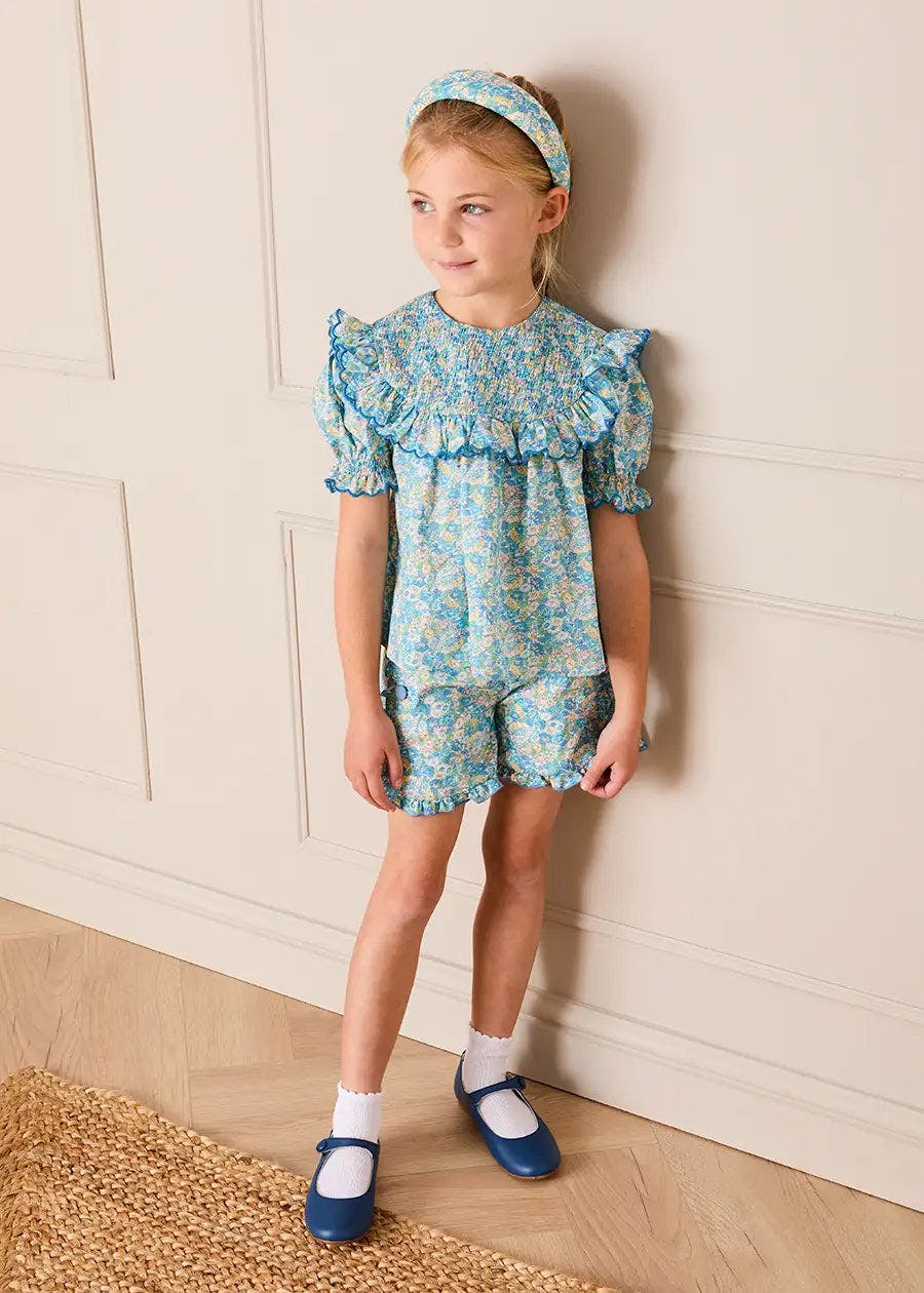 Leontyne Floral Scalloped Smocked Detail Short Sleeve Blouse in Blue Made with Liberty Fabric (2- 10yrs)