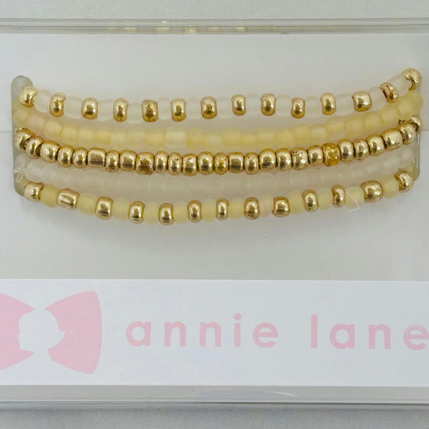 Gold set of five bracelets