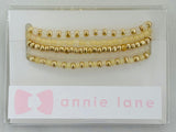 Gold set of five bracelets