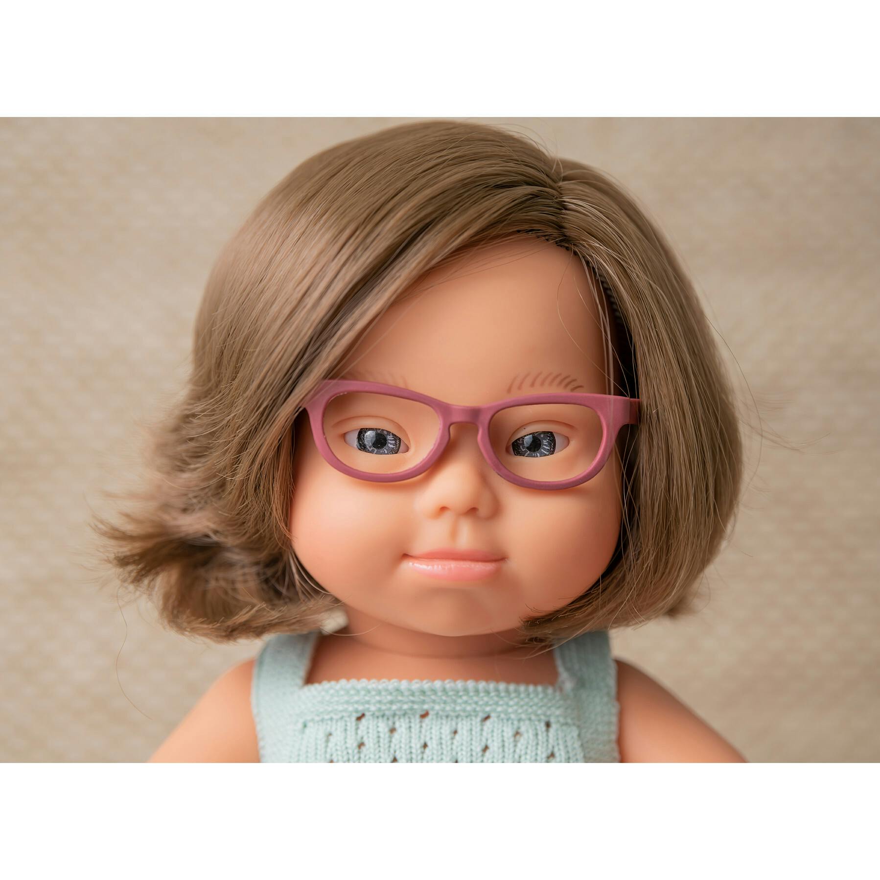 Colourful Edition Collection - Baby Doll Caucasian Girl with Down Syndrome with Glasses 15'' (turquoise rompers)