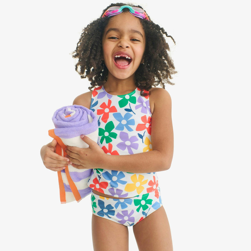 Kids swim tank in rainbow blooms
