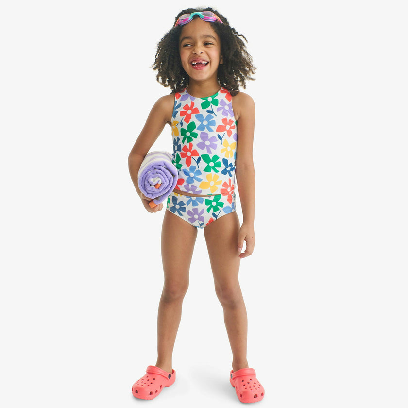 Kids swim tank in rainbow blooms